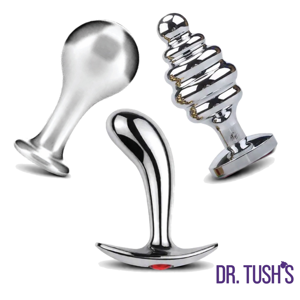 Three metallic butt plugs with 'Dr. Tush's' branding on a white background