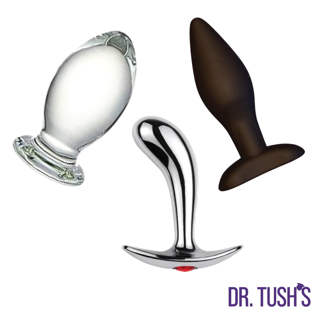 Three anal plugs of Glass, Silicone and metal prostate massager of 'Dr. Tush' products on a white background