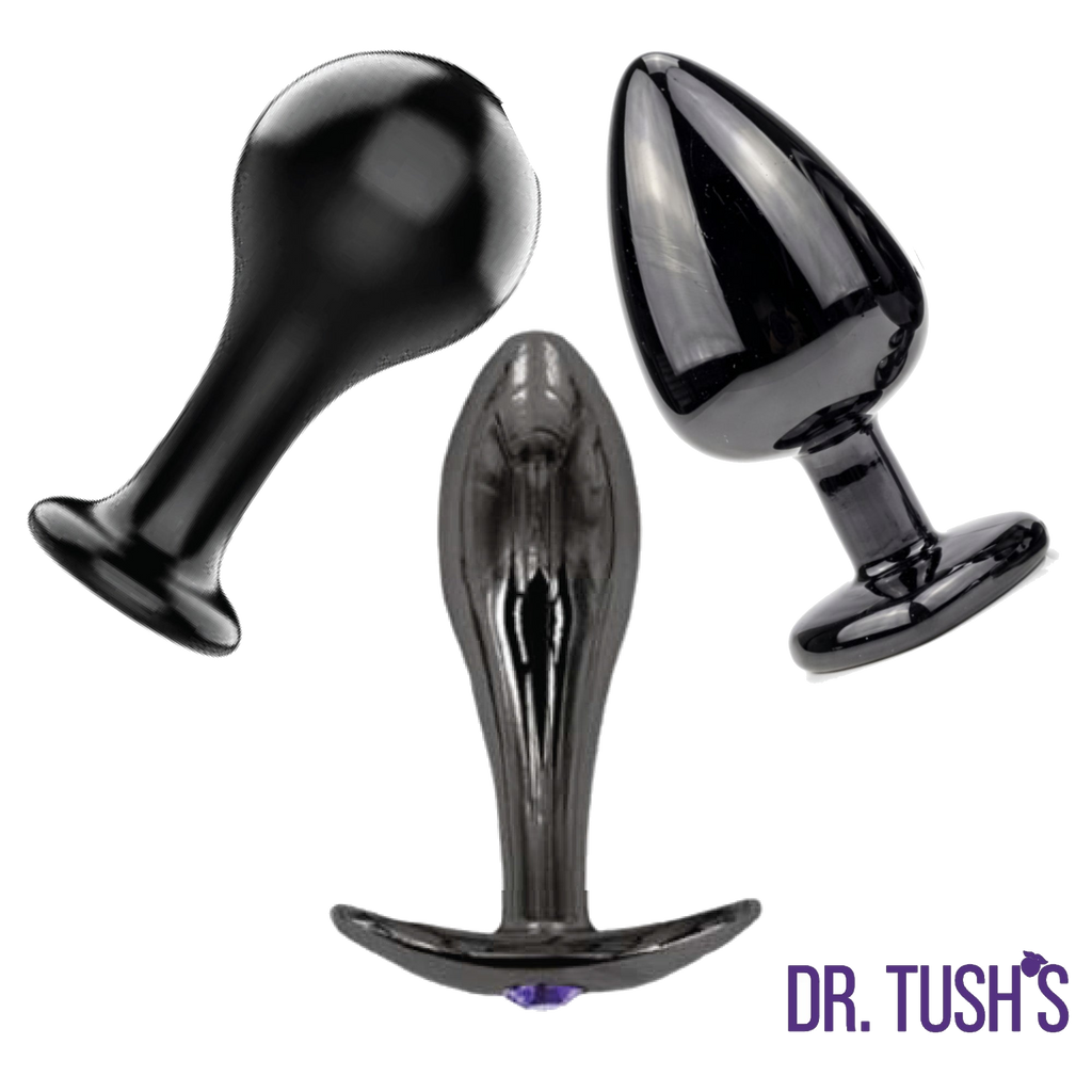 Three black glass anal plugs on a white background with 'Dr. Tush's' branding.