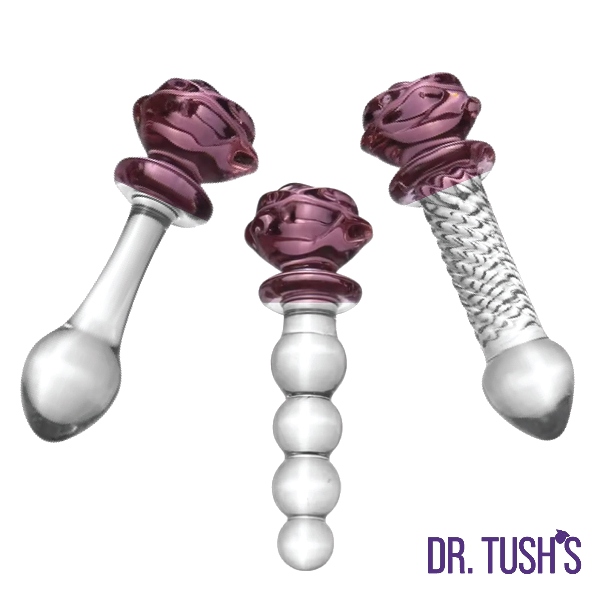Three glass butt plugs and glass dildo with purple rose top and clear design on a white background, branded 'Dr. Tush'.