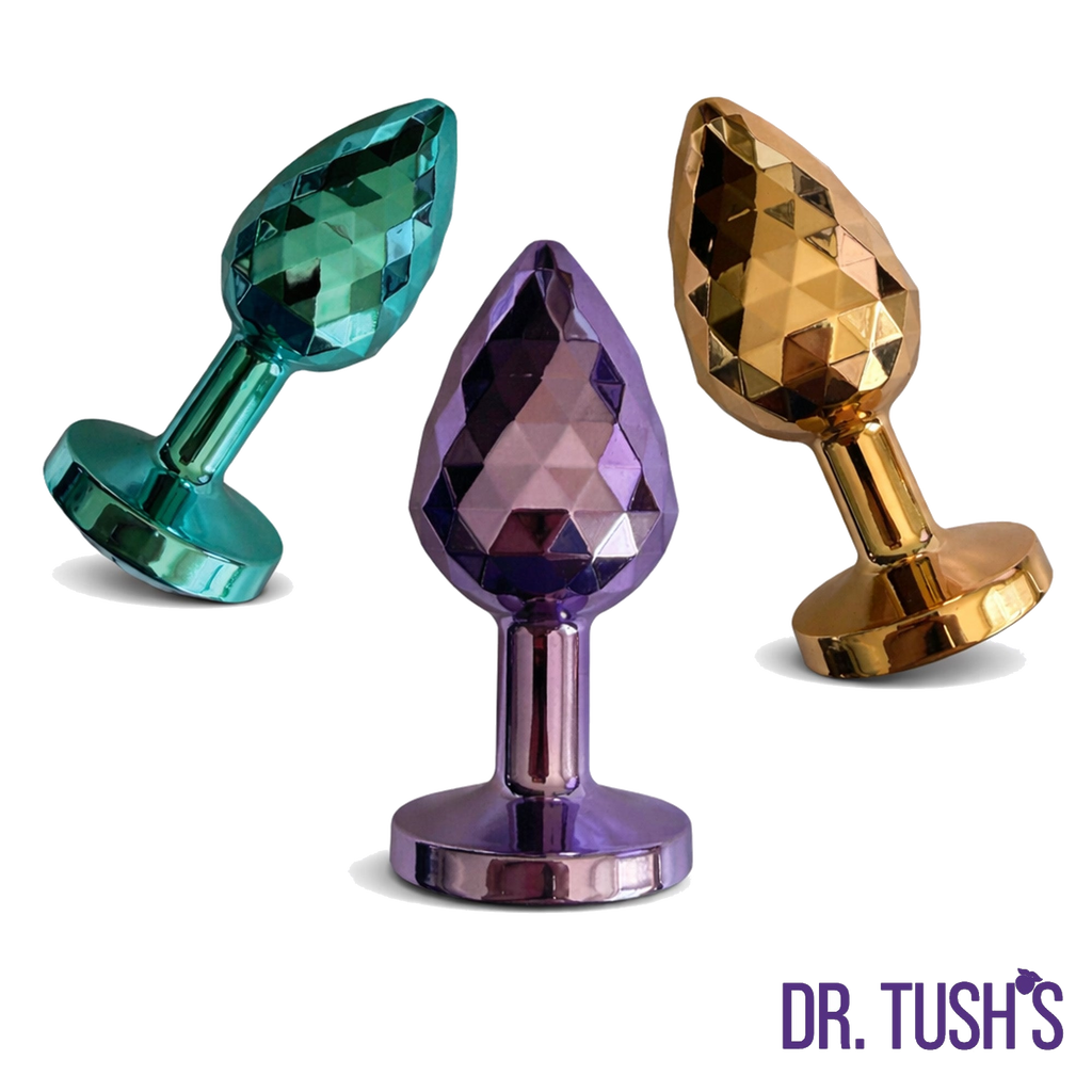 Three colorful anal plugs Dragon Pearls with 'Dr. Tush' branding on a white background