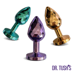 Three colorful anal plugs Dragon Pearls with 'Dr. Tush' branding on a white background