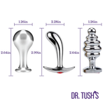 Three metallic butt plugs with measurements and 'Dr. Tush's' branding on a white background