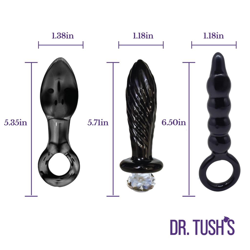 Three black glass butt plugs with dimensions on a white background with 'Dr. Tush's' branding. Dark Curiosity collection